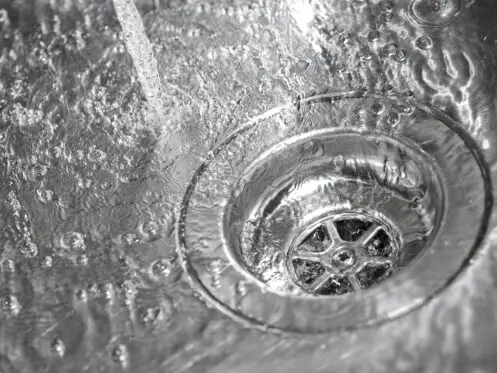 water running down a drain